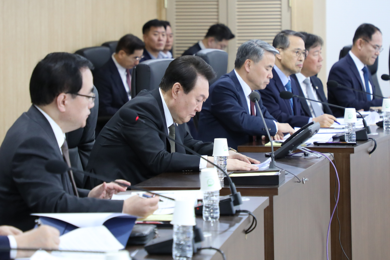 President Yoon Suk Yeol attends a meeting of the National Security Council at the presidential office in Seoul on Thursday to discuss countermeasures against North Korea's firing of an intercontinental ballistic missile (ICBM) into the East Sea.(Yonhap)