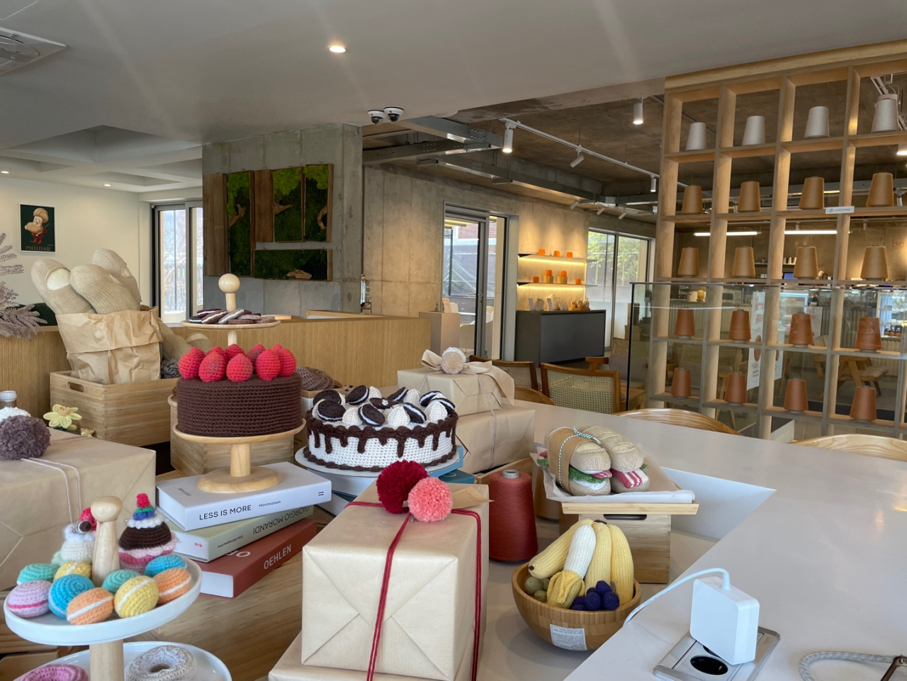 The second floor at Banul Cafe is decorated with knitted food and cactuses. (Park Ga-young/The Korea Herald)