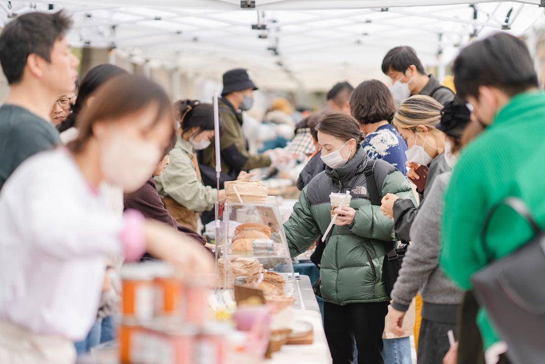 Visitors browse the vendors at “Art in Marche” at the National Theater of Korea on Saturday (NTOK)