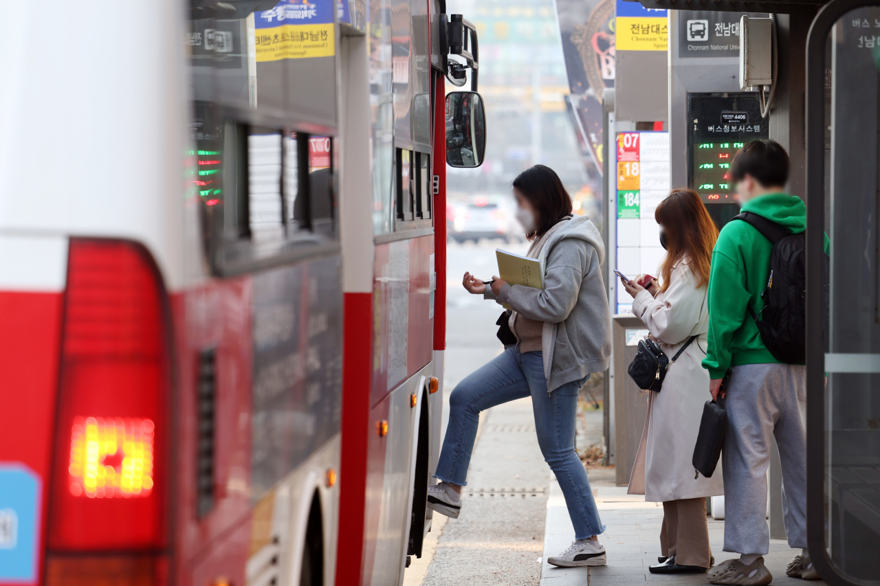 Passengers are seen wearing masks despite the lifting of the mask mandate on public transport on Monday (Yonhap)