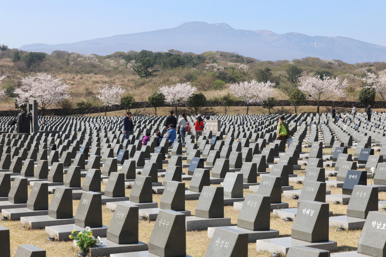 제75주년 제주4·3추념일을 하루 앞둔 2일 오전 제주시 봉개동 제주4·3평화공원 행방불명인 표지에서 유족들이 희생자들의 넋을 기리고 있다. [연합]