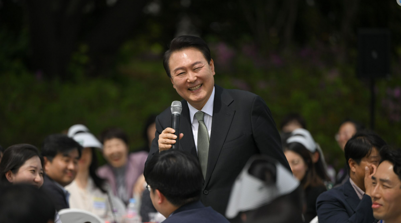 President Yoon Suk Yeol speaks during a luncheon meeting with reporters covering him at the presidential office in Seoul on Tuesday, in this photo released by his office.