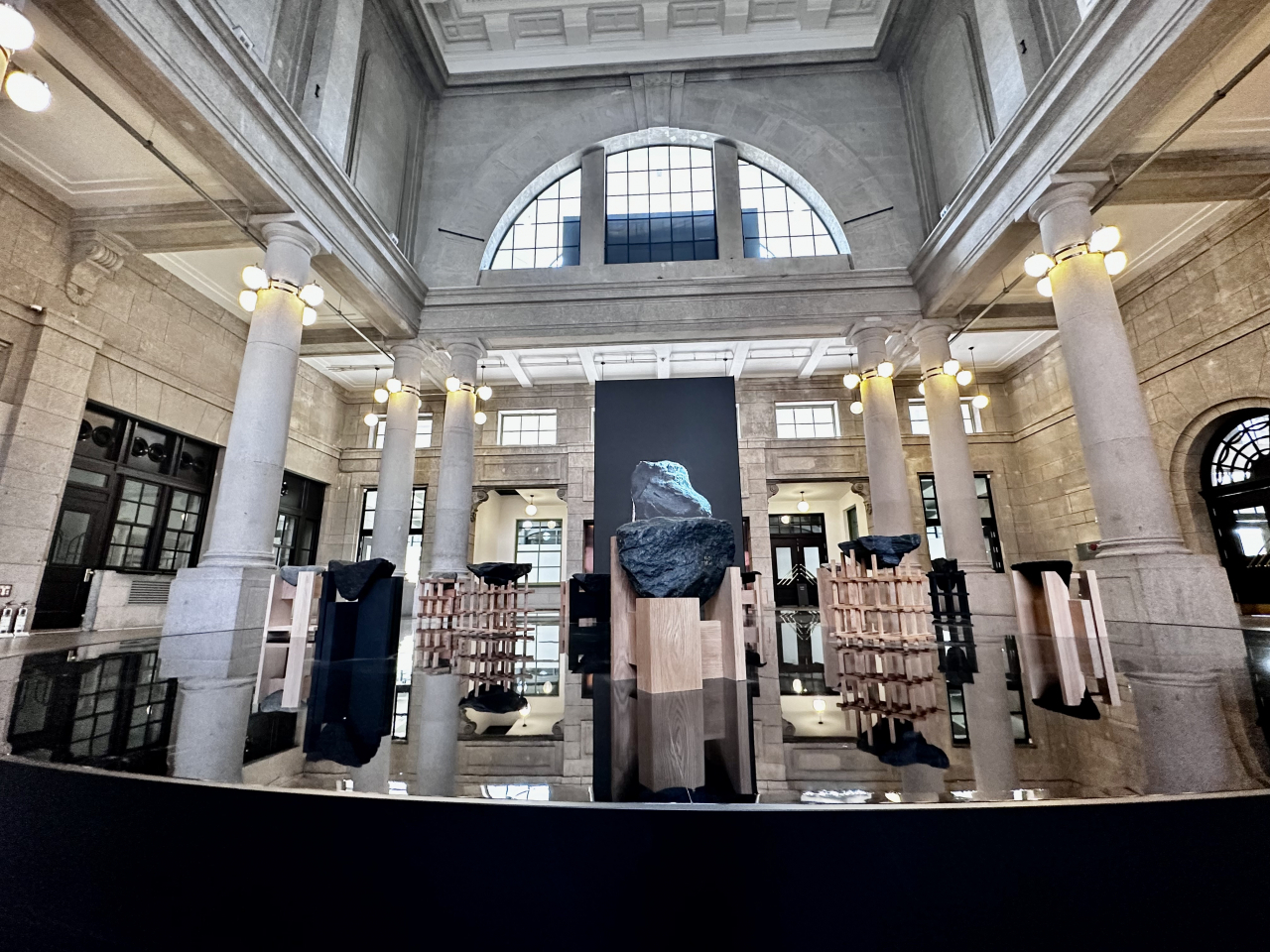 Stone-inspired chairs and a large symbolic stone projection of Jang Sung's "Given (2023)" installation at Culture Station Seoul 284 in Jung-gu, Seoul. (Moon Joon-hyun/The Korea Herald)