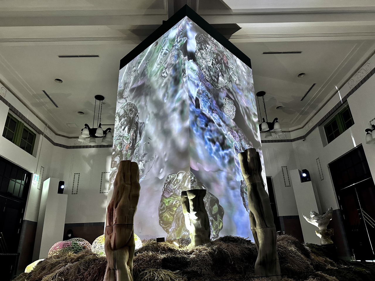 A towering 3D display of "Extended Scenes" by Goo Gi-jeong radiates a surreal digital portrayal of soil, surrounded by innovative nature-inspired works at Culture Station Seoul 284 in Jung-gu, Seoul. (Moon Joon-hyun/The Korea Herald)
