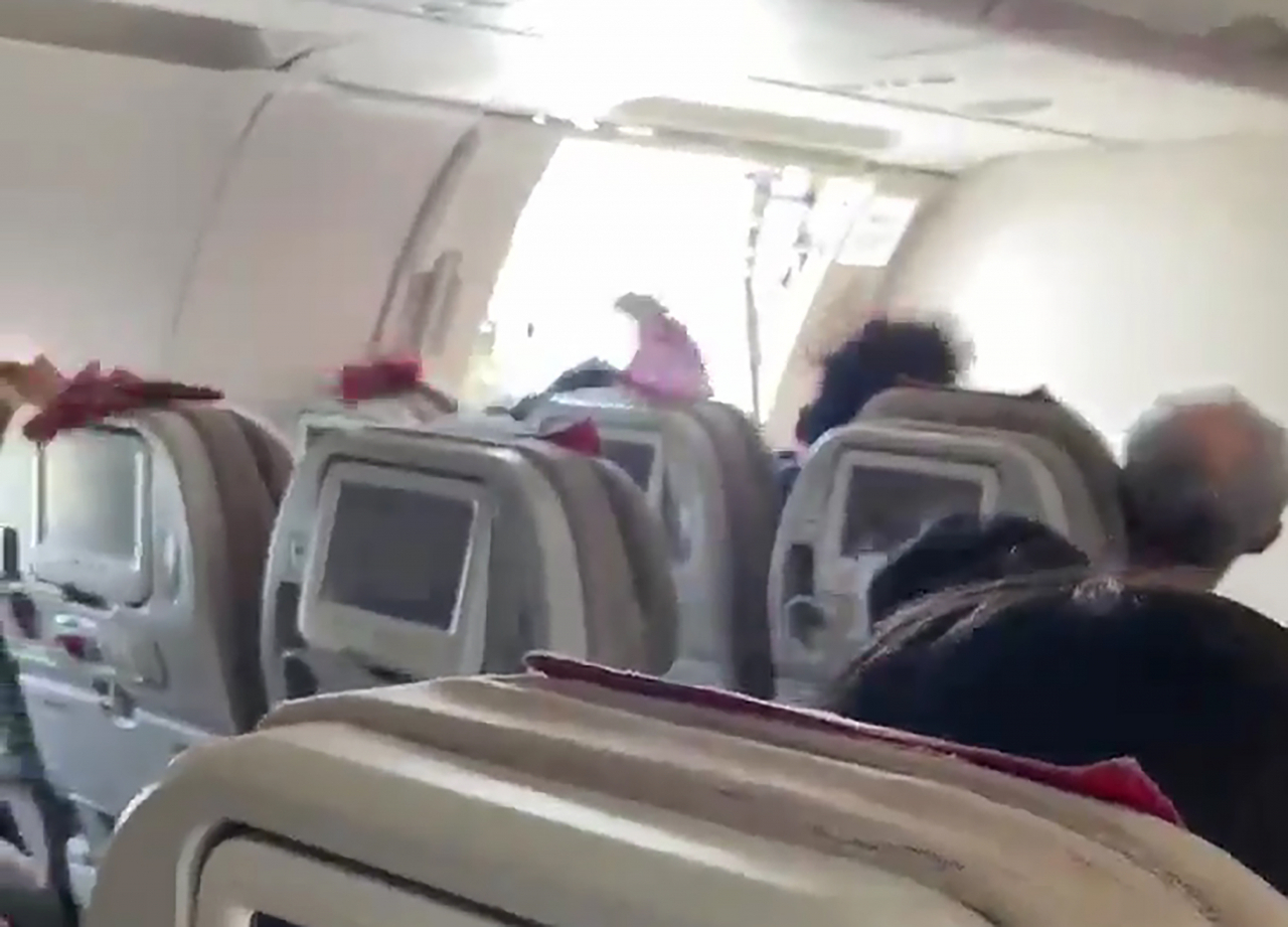 This photo, provided by a third party, shows an airplane's door open before landing on Daegu Airport Friday. (Yonhap)