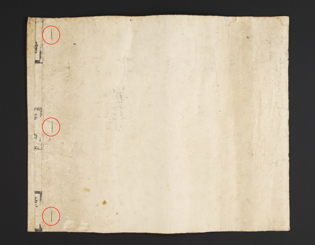 A bundle of oral test evaluation papers shows the papers were folded, sealed and tied with a string (NPMK)