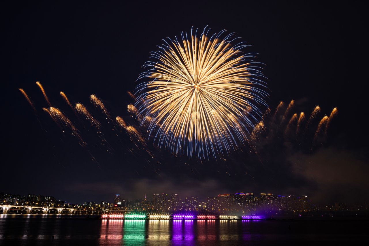 Fireworks are displayed over the Han River and Yeouido Hangang Park on Saturday during BTS' 10th anniversary festival "2023 BTS Festa." (Hybe/Big Hit Music)