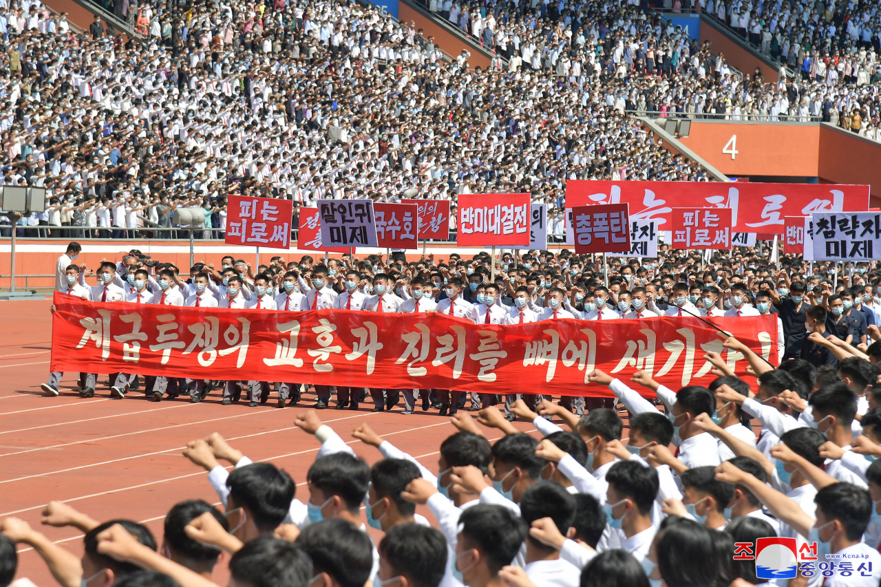 This photo shows a mass rally by workers, youth and students against "U.S. imperialism" in Pyongyang on the occasion of the 73rd anniversary of the start of the 1950-53 Korean War on Sunday. (KCNA)