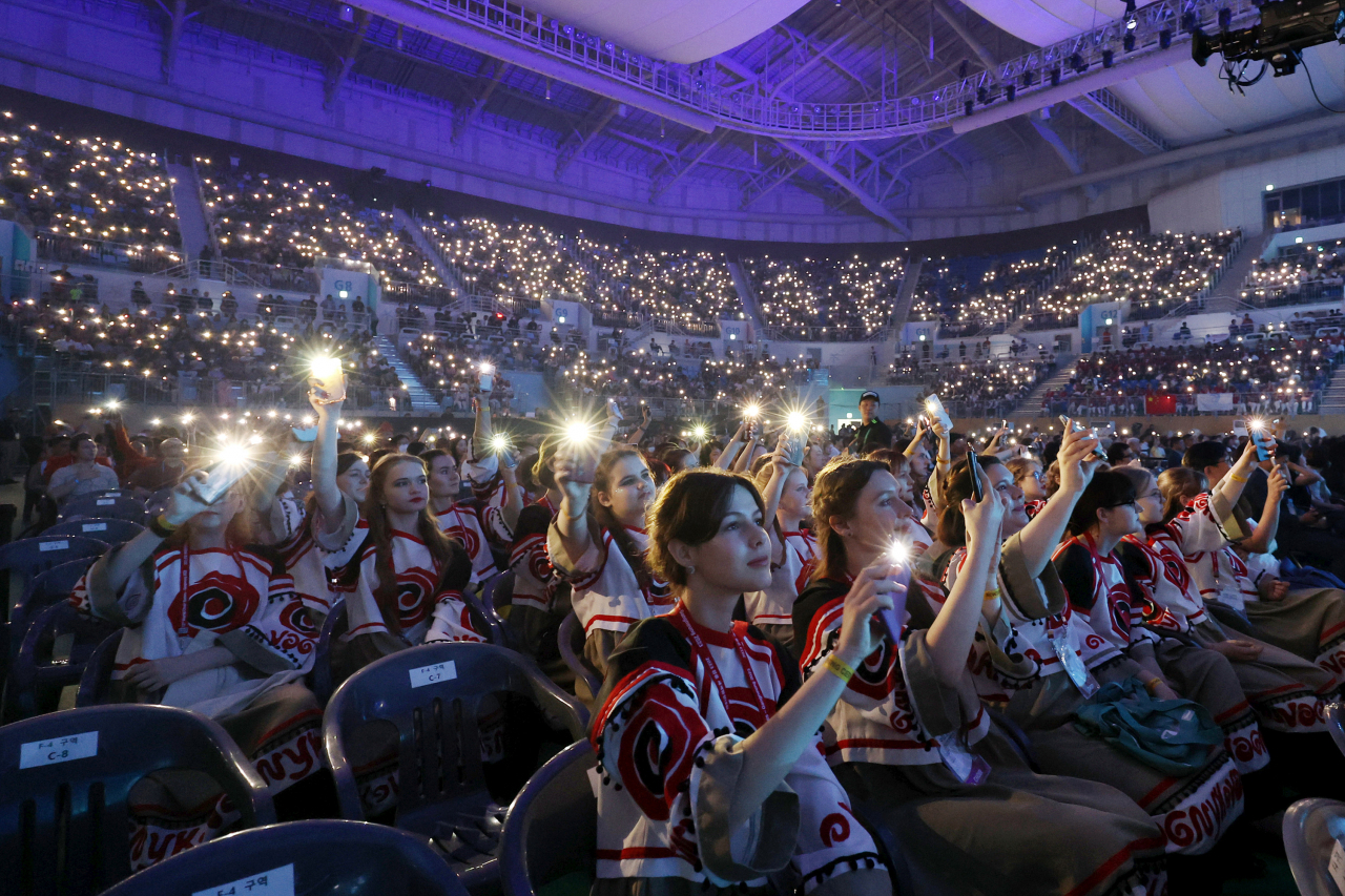 Members of Ukrainian girls' choir Vognyk participate in the opening ceremony of the 12th World Choir Games in Gangneung Arena on Monday. (WCG 2023 Gangneung Organizing Committee)