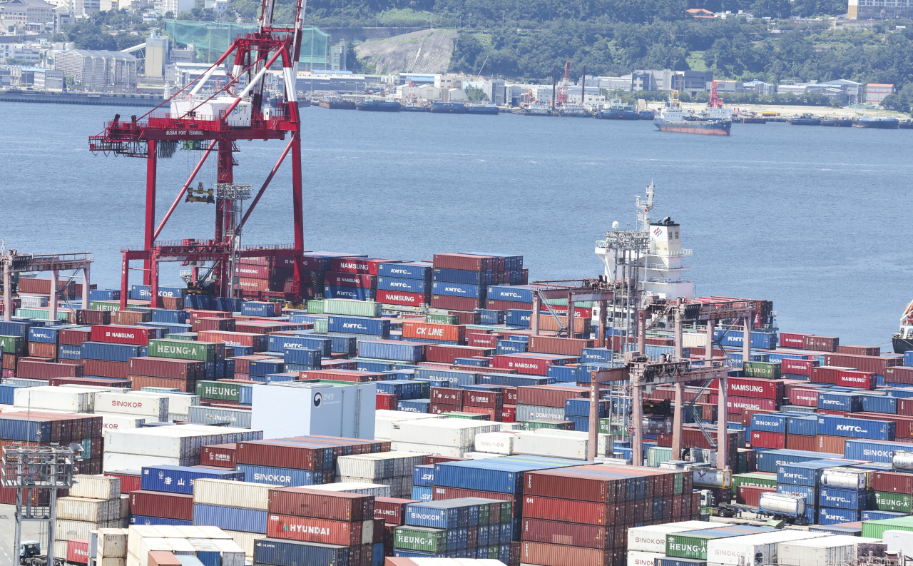 Shipping containers are stacked high at a port in Busan, 320 kilometers southeast of Seoul, in this file photo taken Aug. 1, 2023. (Yonhap)