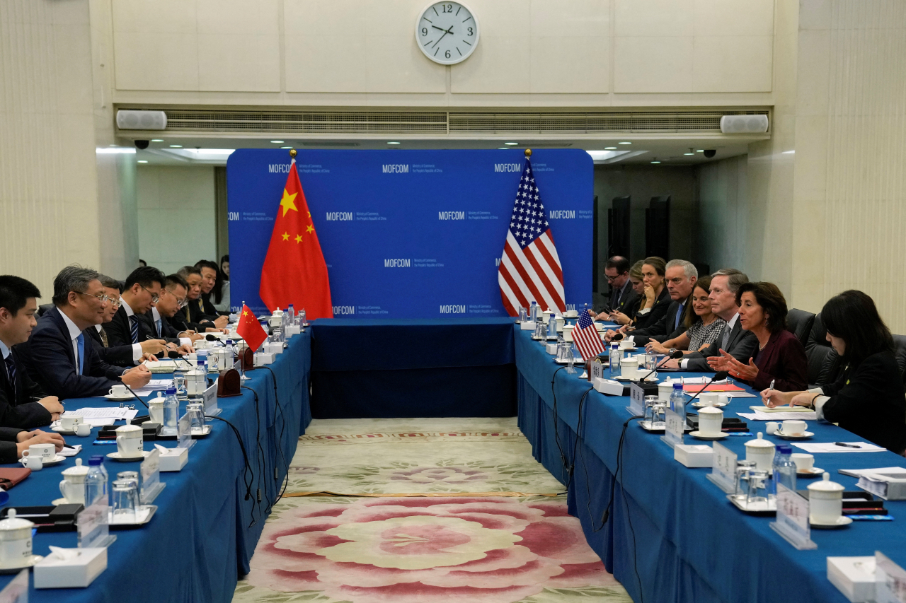 U.S. Commerce Secretary Gina Raimondo, second right, speaks during a meeting with Chinese Minister of Commerce Wang Wentao, second left, at the Ministry of Commerce in Beijing, Monday, Aug. 28, 2023. Andy Wong/[Pool via REUTERS]