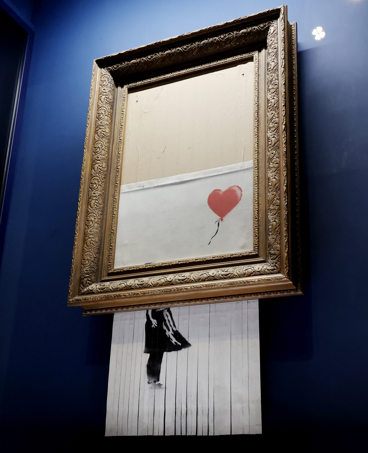 This photo, taken Aug. 31, 2023, shows "Love is in the Bin," an iconic piece by British graffiti master Banksy, at Paradise City, an integrated resort complex in Incheon, west of Seoul, ahead of the "Love in Paradise: Banksy and Keith Haring" exhibition that will run from Sept. 5 to Nov. 5 and feature 36 works by Banksy and Haring with free admission. (Yonhap)
