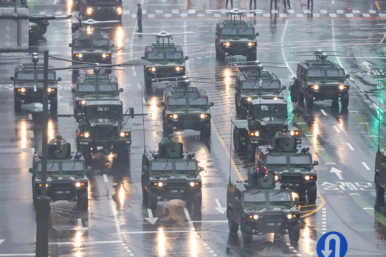 A diverse array of unmanned aerial vehicles are featured during a military street parade on Tueday. (Yonhap)