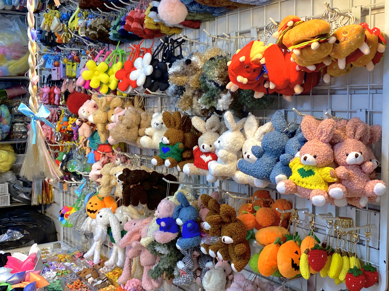 Plush keyrings are hung on a display rack. (Hwang Joo-young/The Korea Herald)