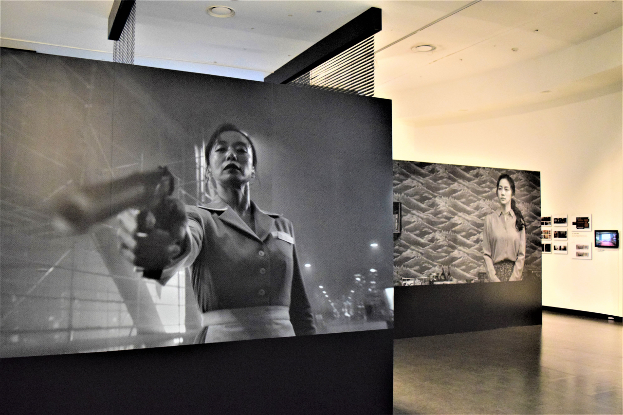 Scenes from "Kill Boksoon" (2023) (front) and "Decision to Leave" (2022) are on display at the special exhibition at the Korean Film Museum in Sangam-dong, Seoul. (Kim Hae-yeon/ The Korea Herald)