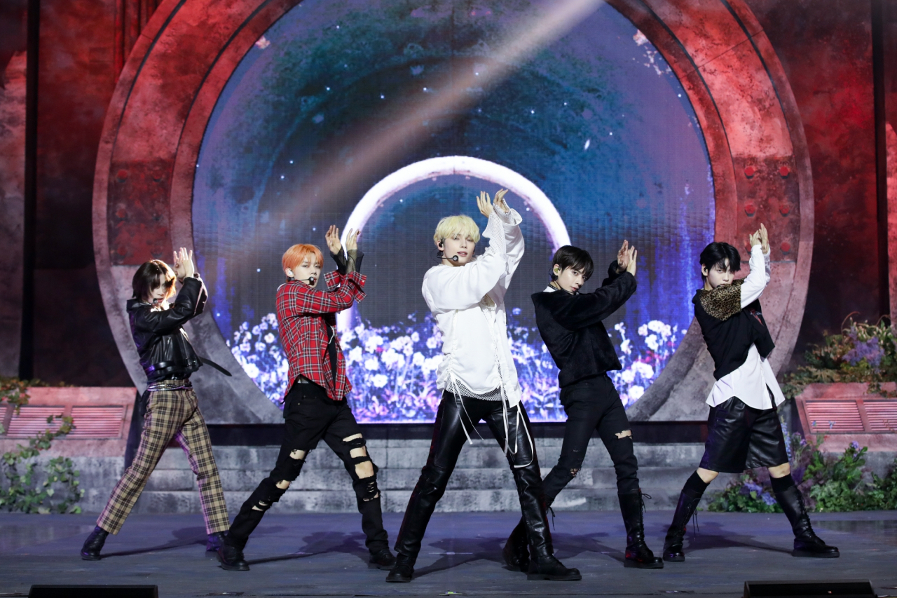Tomorrow X Together performs "Chasing That Feeling" during a press event for its third LP, "The Name Chapter: Freefall," at Seoul's Kyung Hee University Grand Peace Palace on Thursday. (Big Hit Music)