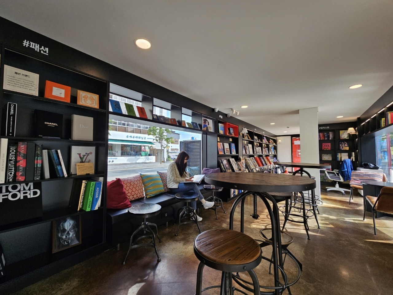 A visitor reads books at the Cheotmajunggil Library in Jeonju, North Jeolla Province (Kim Hae-yeon/ The Korea Herald)