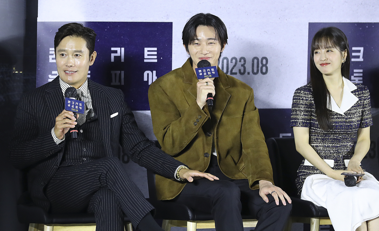 The stars of the movie "Concrete Utopia" pose for a photo during a press conference in Seoul, June 21, 2023. (Newsis)