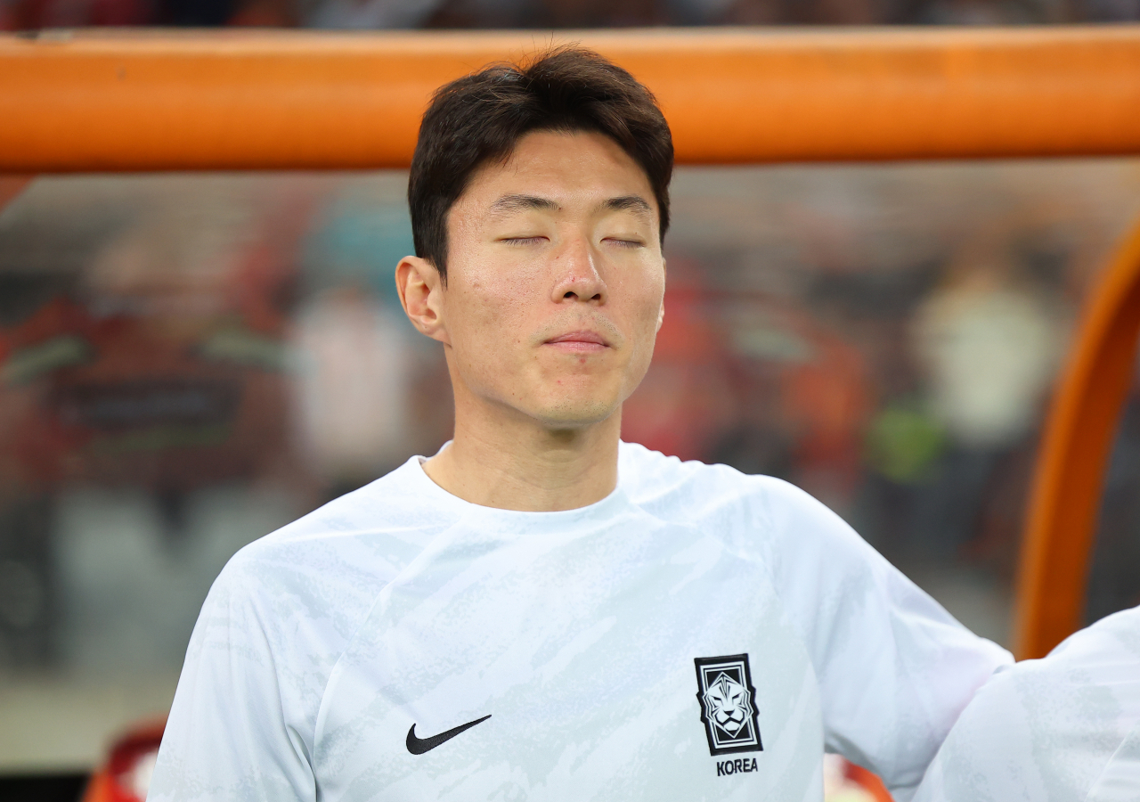Hwang Ui-jo of South Korean stands on the sidelines for the national anthem before the start of a World Cup qualifying match against China at Shenzhen Universiade Sports Centre in Shenzhen, China, on Tuesday.(Yonhap)