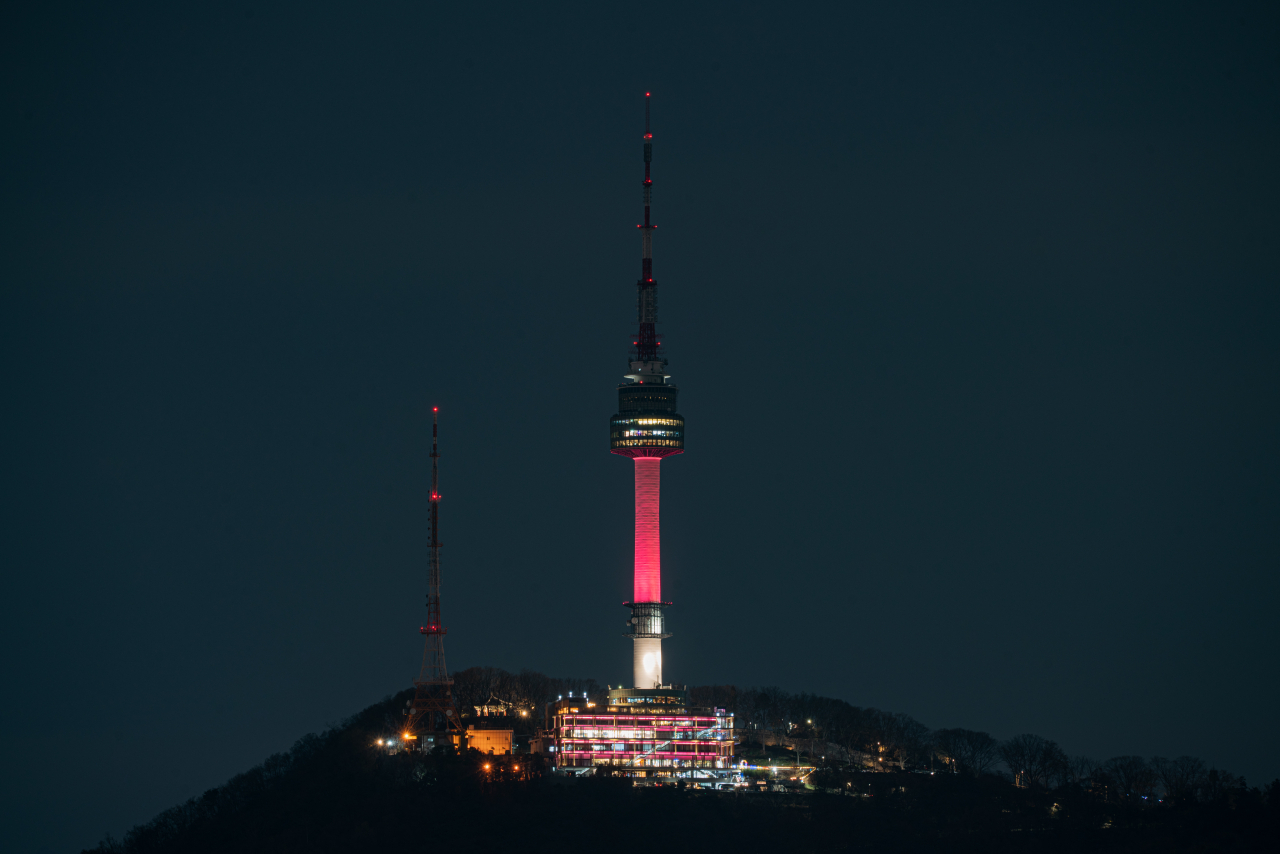 The N Seoul Tower in Yongsan-gu, central Seoul, is lit up in sky coral, the "Color of Seoul" for 2024. (Seoul Metropolitan Government)