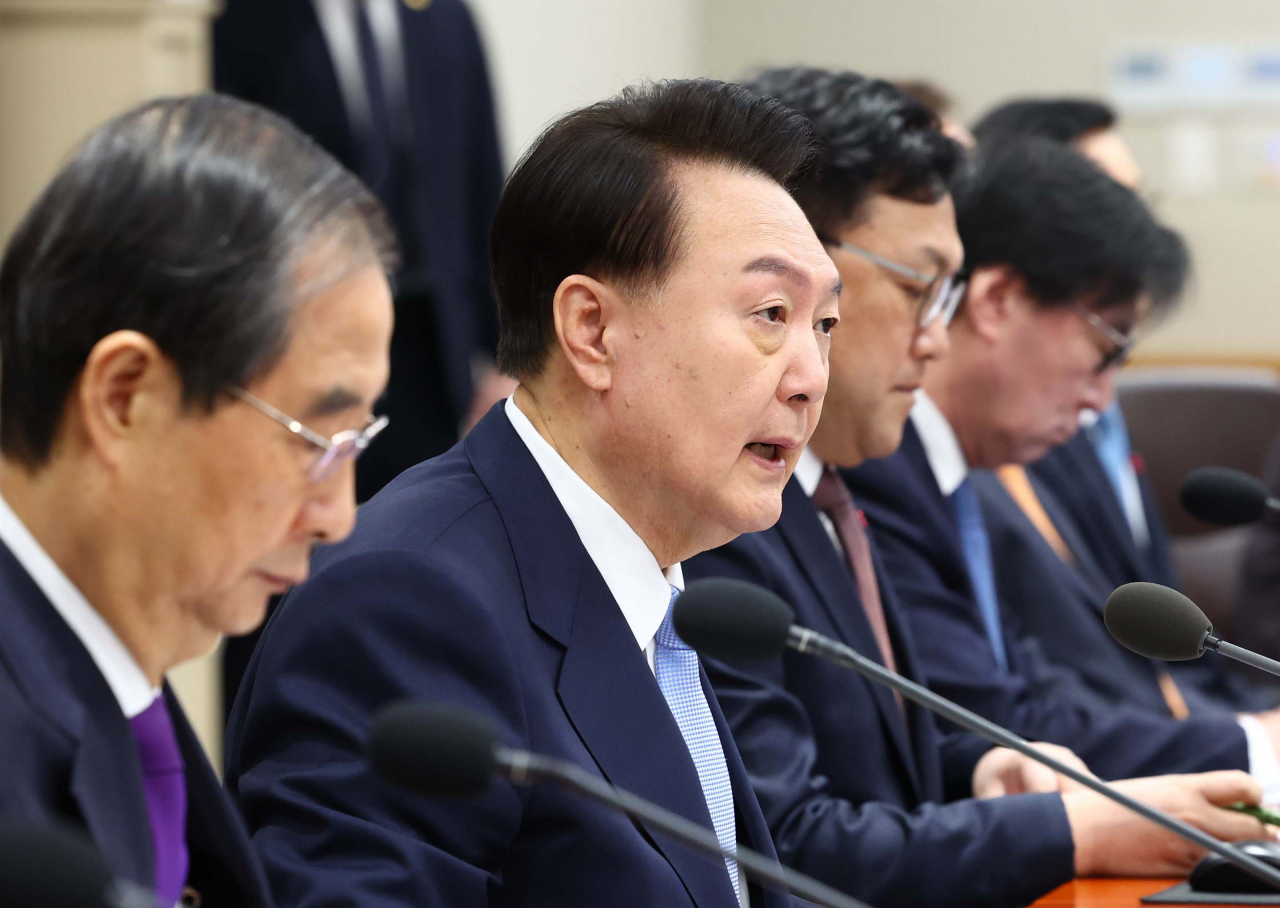 President Yoon Suk Yeol (second from left) presides over a Cabinet meeting at the presidential office in Seoul on Tuesday. (Yonhap)