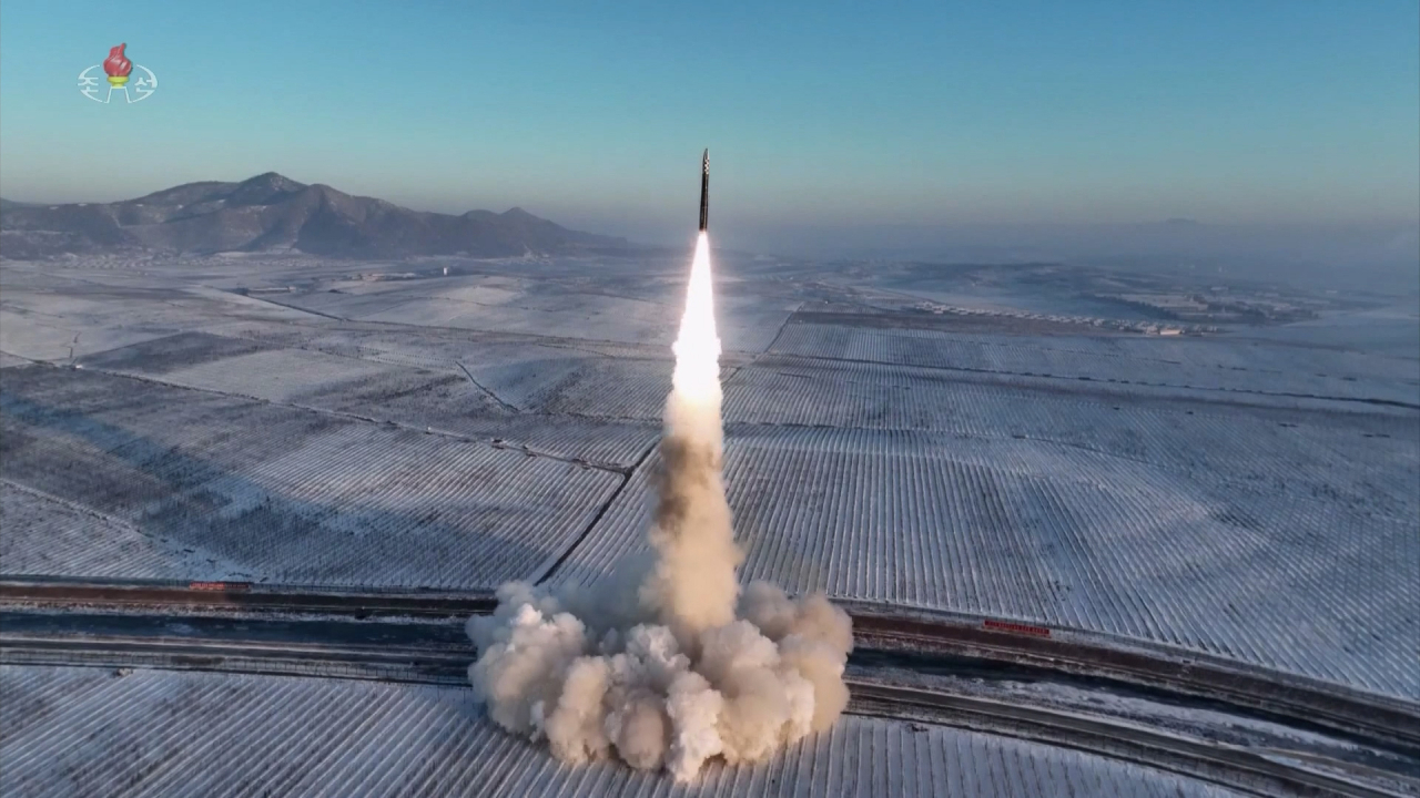 North Korea fires a Hwasong-18 solid-fuel intercontinental ballistic missile on Monday, with its leader Kim Jong-un observing the launch. The ICBM flew 1,002.3 kilometers for 4,415 seconds at a maximum altitude of 6,518.2 km before "accurately" hitting the East Sea. (Yonhap)