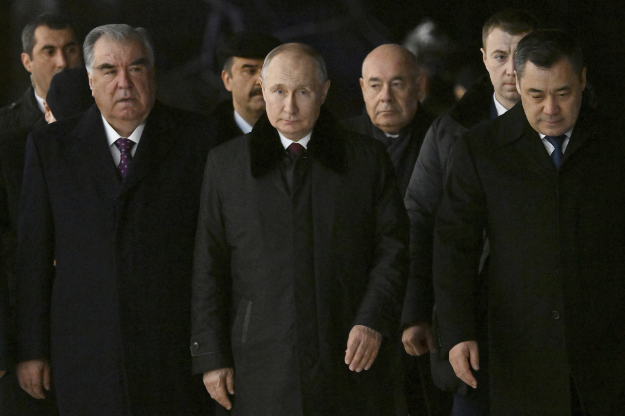 Tajikistan's President Emomali Rahmon, Russian President Vladimir Putin and Kyrgyzstan's President Sadyr Japarov (from left in the first row) visit the Peterhof State Museum and Reserve in St. Petersburg, Russia, Tuesday, Dec. 26. (AP)