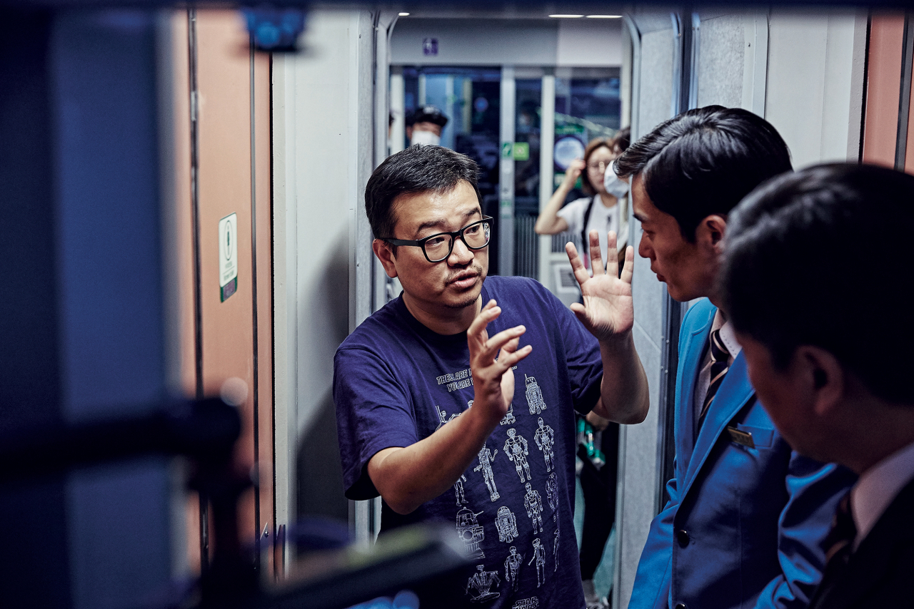 Director Yeon Sang-ho is seen on the set of “Train to Busan.” (Next Entertainment World)