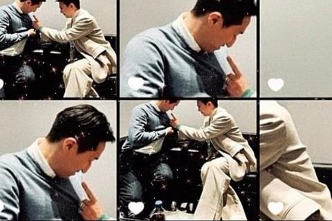 가수 지드래곤이 9일(현지시각) 미국 라스베이거스에서 열린 'CES2024'에서 정기선 HD현대 부회장의 가슴에 브로치를 달아주고 있다. [지드래곤 인스타그램]