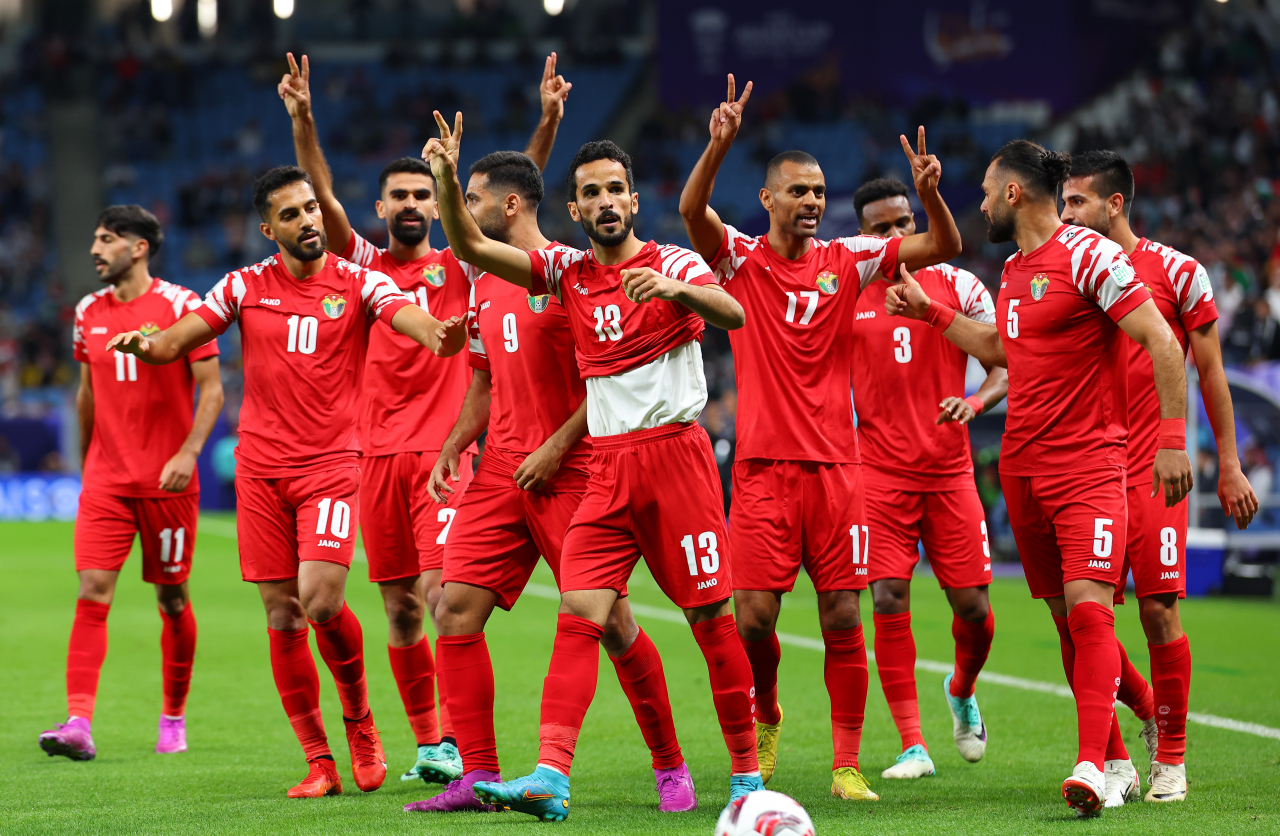 Jordan players celebrate a goal by Mahmoud Al-Mardi (Center, No. 13) against Malaysia during the teams' Group E match at the Asian Football Confederation Asian Cup at Al Janoub Stadium in Al Wakrah, Qatar, on Monday. (Yonhap)