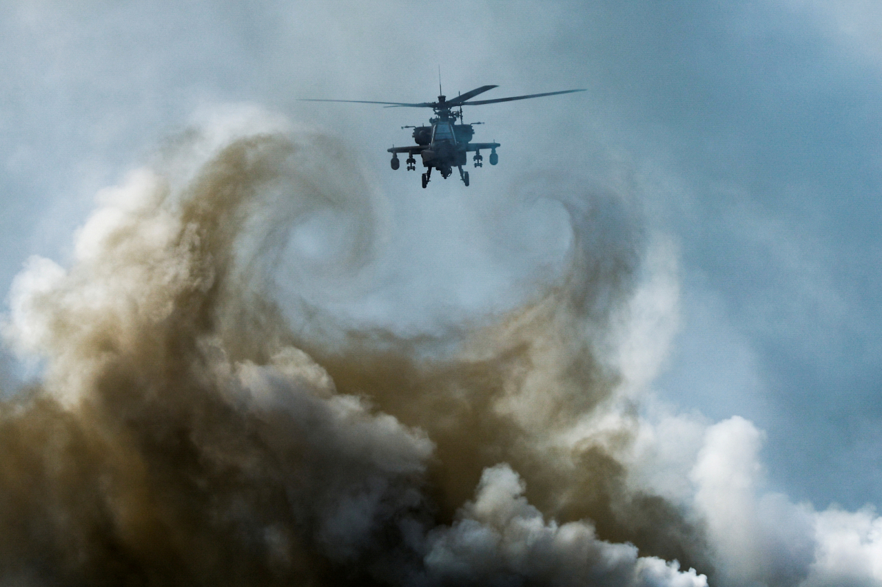 A military helicopter flies during an amphibious assault exercise as part of the "Cobra Gold 2024" joint military exercise at a military base in Chonburi province, Thailand, March 1. (Reuters-Yonhap)