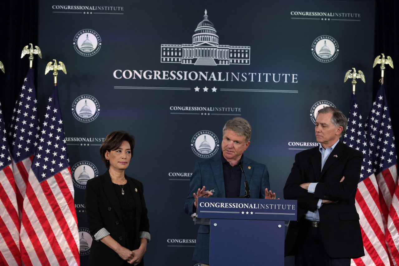 Rep. Young Kim (R-CA) (left) and Rep. French Hill (R-AR) (right) listen at the Greenbrier Hotel on March 14, 2024 in White Sulphur Springs, West Virginia.