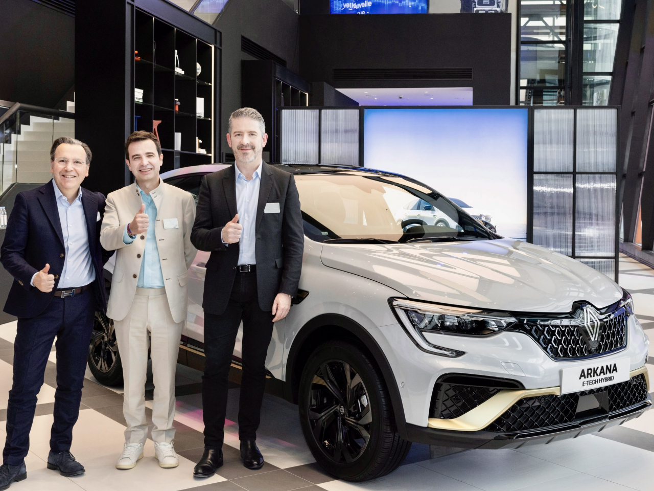From left: Arnaud Belloni, Renault Group's vice president of global marketing, Stephane Deblaise, CEO of Renault Korea, and Jill Vidal, the group's design director, stand next to the renamed Renault Arkana, formerly the XM3, during a press conference in Seoul on Wednesday. (Renault Korea)