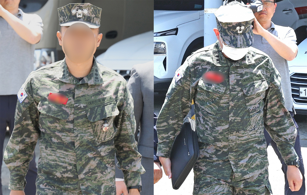 해병대 1사단 7여단장(왼쪽)과 11포병 대대장(오른쪽)이 19일 낮 대질 조사를 받기 위해 경북 경산 경북경찰청 형사기동대 청사로 향하고 있다. [연합]