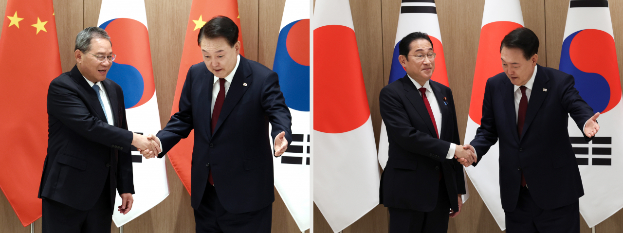 윤석열 대통령이 26일 서울 용산 대통령실에서 리창 중국 국무원 총리(사진 왼쪽), 기시다 후미오 일본 총리와 각각 양자 회담을 하며 악수를 나누고 있다. [연합]