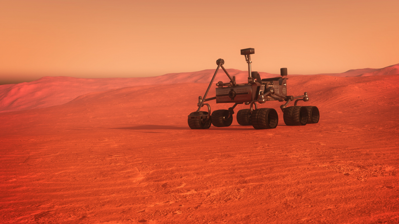 A rendered image of a scientific exploratory vehicle on the surface of a Mars-like red sand planet. (123rf)