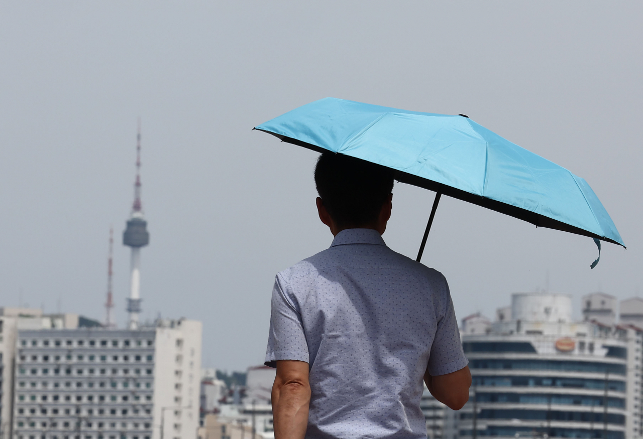 A man walks in central Seoul on June 27. (Yonhap)