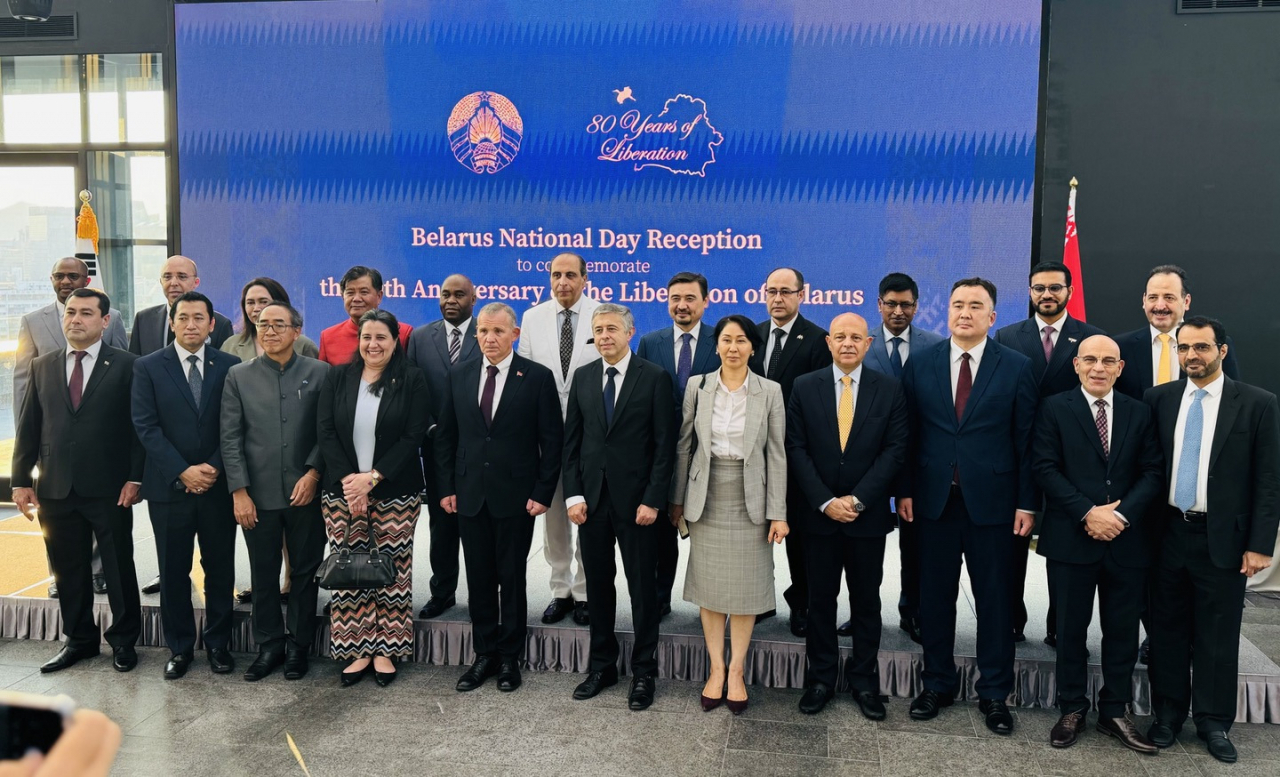 Members of the diplomatic corps pose for a group photo at Belarusian National Day at the Ambassador Hotel in Jung-gu, Seoul on Friday.(Sanjay Kumar/ The Korea Herald)