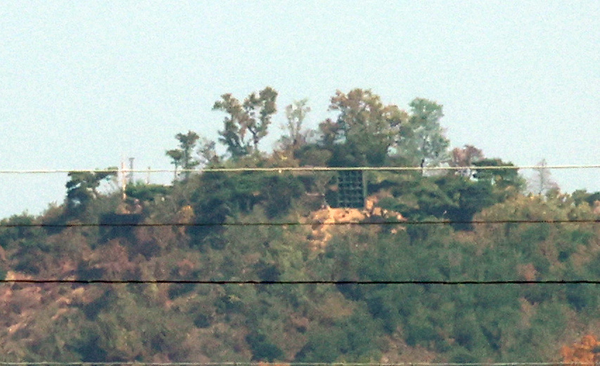 Loudspeakers are visible on a hillside in Gaepung-gun, Hwanghae-do, North Korea, as seen from Songhae-myeon, Ganghwa-gun, Incheon, on Oct. 31. (Yonhap)