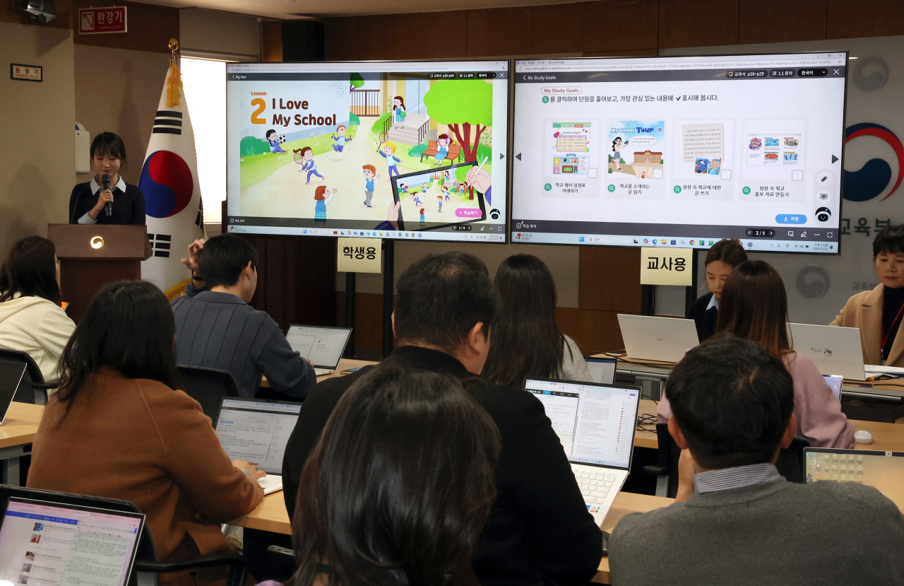 An official demonstrates the key features of a certified AI digital textbook, highlighting its potential for personalized student education, during an event held at the Ministry of Education's conference room in the Government Complex Sejong on Monday. (Yonhap)