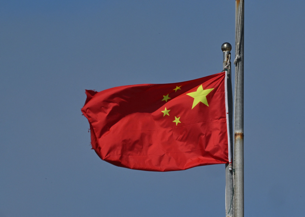 China'ss national flag flutters on Pingtan island, the closest point in China to Taiwan's main island, in southeast China's Fujian province on December 11. (AFP)