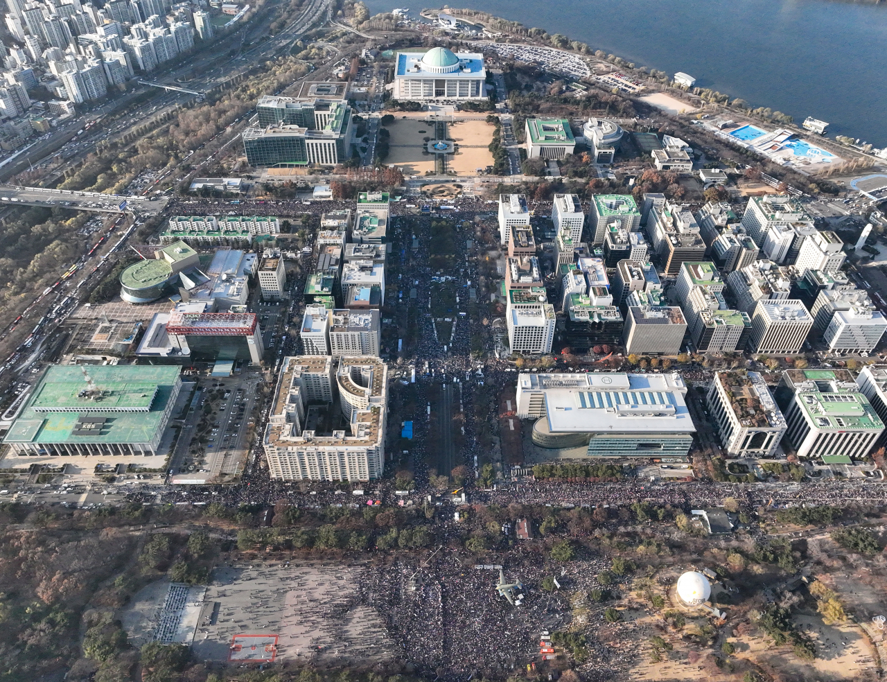 Tens of thousands of protesters fill the streets in front of the National Assembly in Yeouido in Seoul on Saturday ahead of the vote to impeach President Yoon Suk Yeol. (Yonhap)