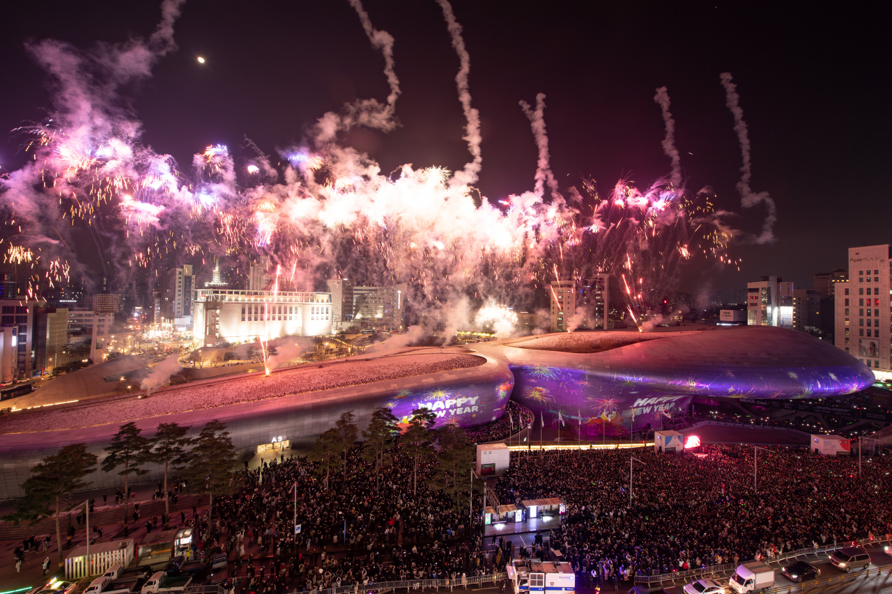 Fireworks are set off during the Dongdaemun Design Plaza's New Year's Eve countdown event on Dec. 31, 2023. (Seoul Design Foundation)