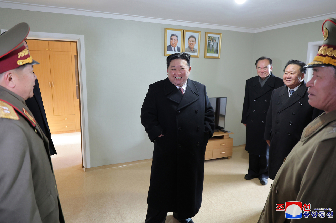 North Korean leader Kim Jong-un inspects a rebuilt house in a flood-hit area in North Phyongan Province in this photo published on Sunday. (KCNA)