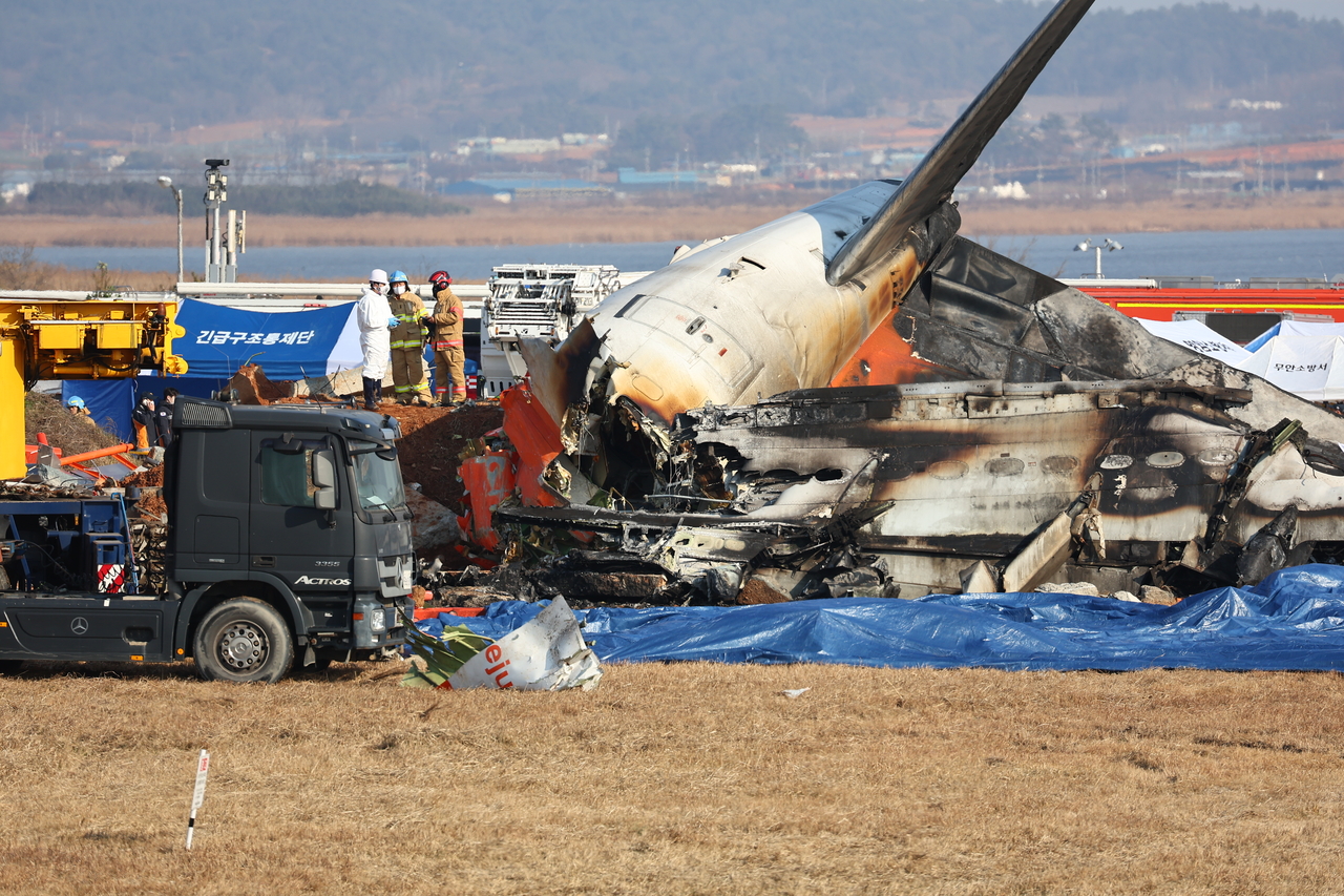 Wreckage of Jeju Air 7C 2216 after its deadly crash landing at Muan International Airport in South Jeolla Province on Sunday (Yonhap)