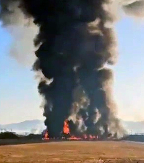 Flames erupt from a plan at Muan International Airport after it veered off the runway Sunday. (Yonhap)
