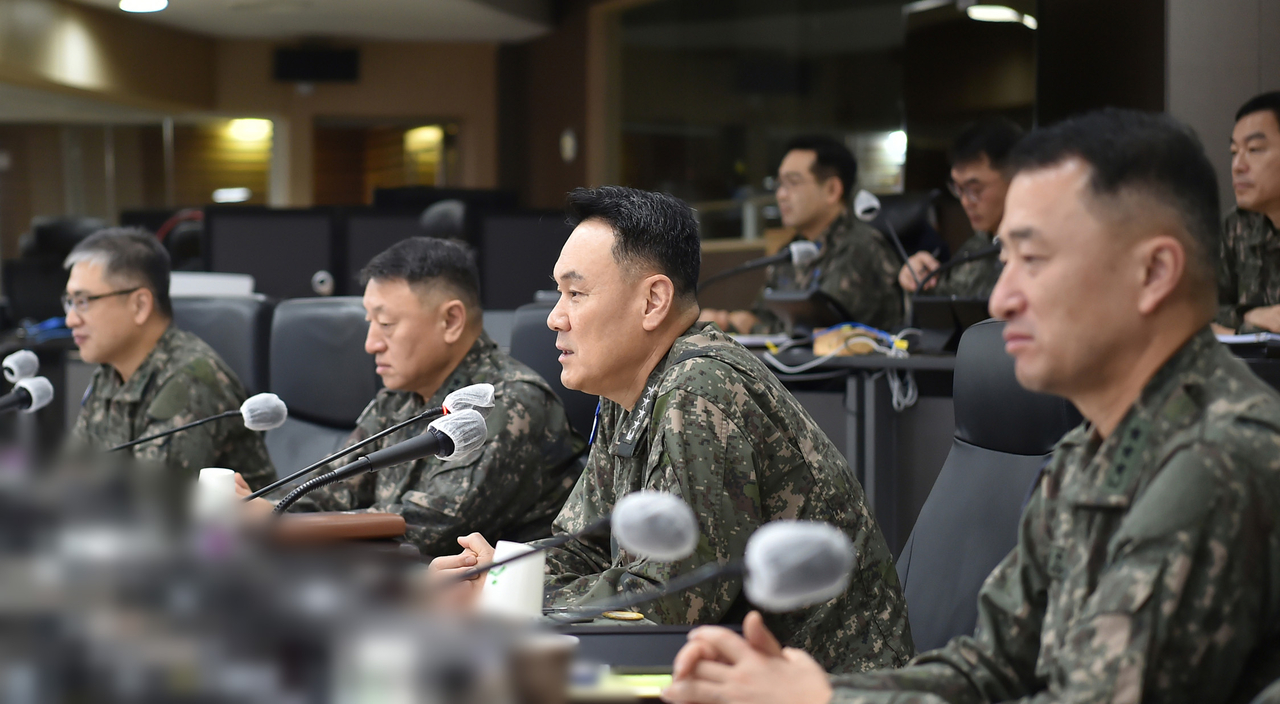 This photo, provided on Wednesday, shows Adm. Kim Myung-soo, chief of the JCS, checking a readiness posture by holding phone talks with top commanding officers at the JCS' combat control room. (JCS)
