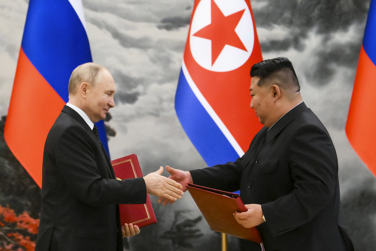 Russian President Vladimir Putin and North Korean leader Kim Jong-un exchange documents during a signing ceremony of a new partnership in Pyongyang, North Korea, on June 19, 2024. (File Photo - Kremlin Pool Photo via AP)