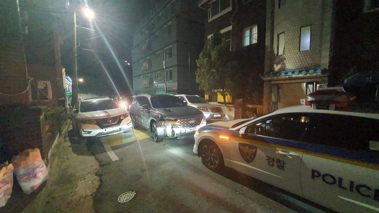 A car driven by a drunk driver is blocked by a patrol car and motorcycles driven by two civilians, who helped police chase down the suspect, in this Oct. 1, 2024, photo provided by Bupyeong Police Station. (Incheon Bupyeong Police Station)