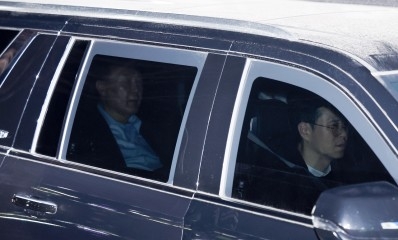 Impeached President Yoon Suk Yeol is taken to the Seoul Detention Center after being questioned over his short-lived imposition of martial law at the Corruption Investigation Office for High-ranking Officials in Gwacheon, just south of Seoul, on Tuesday (Yonhap)
